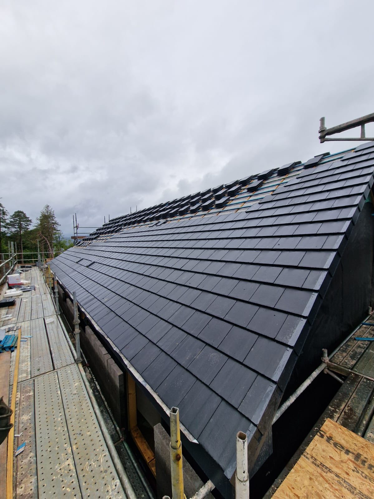 C Livingston Roofing team working on a roof in Helensburgh